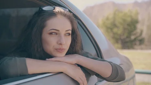 lady leans out car window footage 111903376 iconl Airport Transfers Lady Leans Out Car Windows